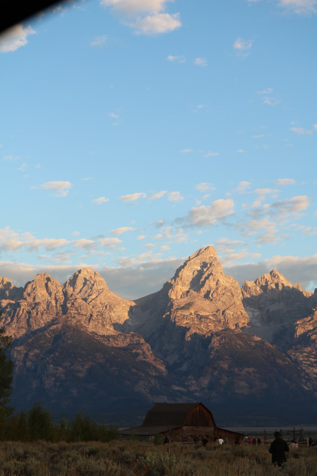 Looking up at the glowing peaks above the historic barn